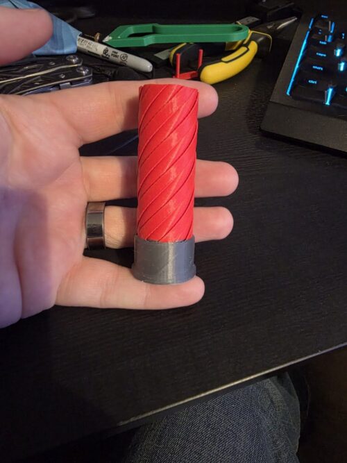 Shotgun shell inspired 3D printed twist fidget toy by Binary Atlas