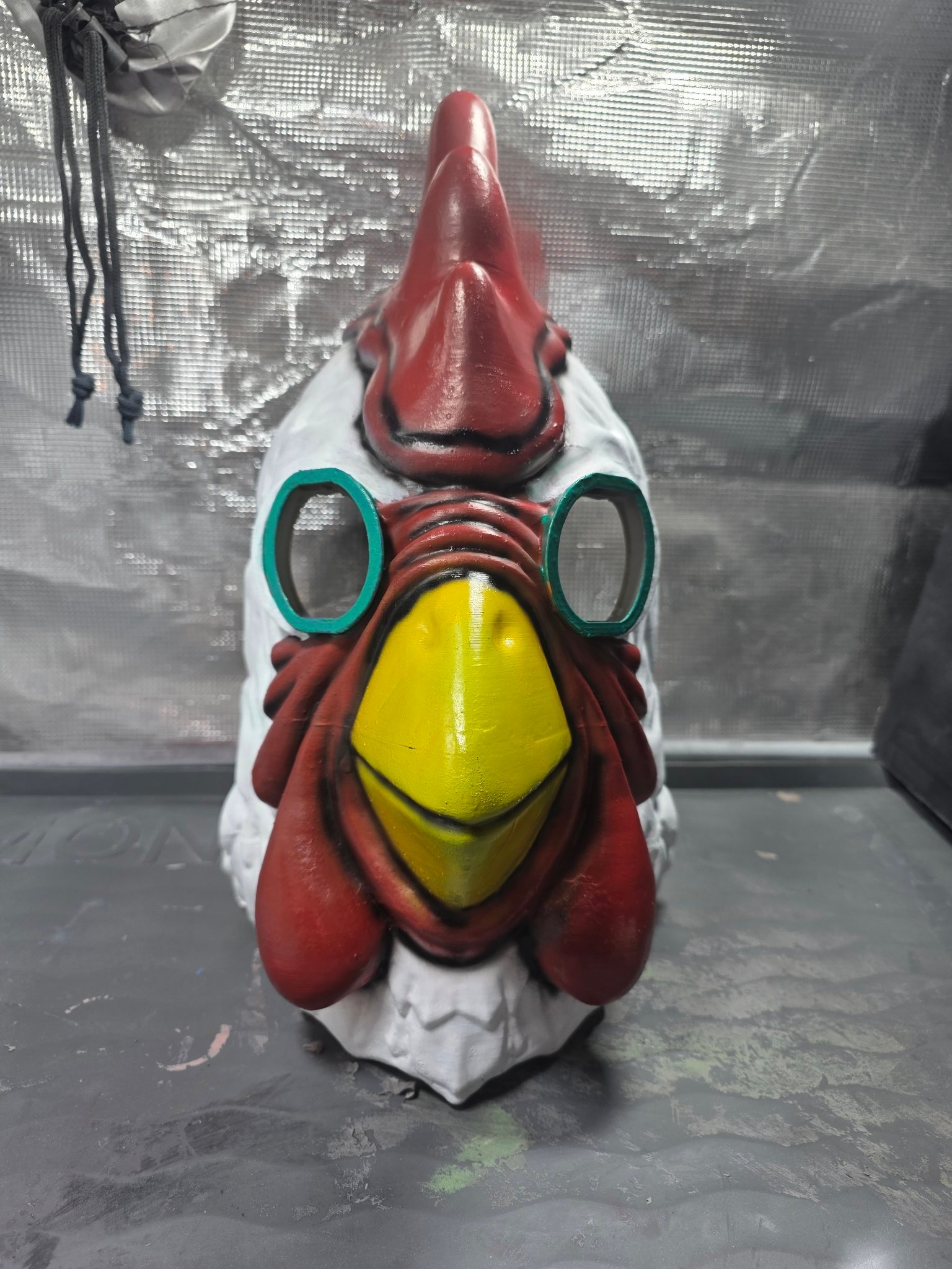Finished hand-painted Payday 2 chicken mask, straight-on front view